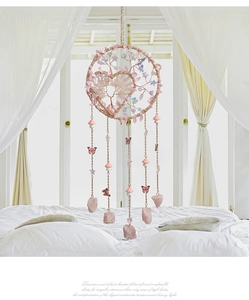 Detail of pink crystal Tree of Life dream catcher with butterfly and mushroom charms