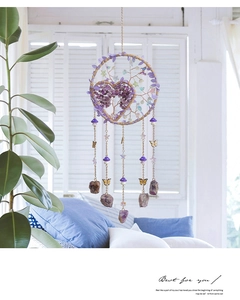 Detailed view of handmade purple life tree dream catcher with amethyst stones and crystals