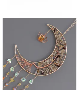Detail of handmade gold crescent moon Tree of Life suncatcher with crystal beads