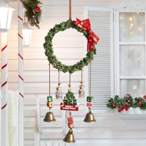 Vintage Christmas wreath ornament with festive red bow, mini glass bottles and bronze bells