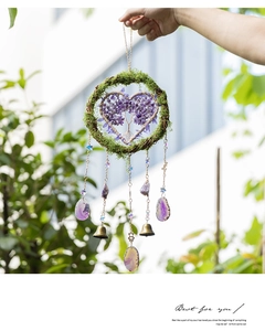 Detail of tree of life wall hanging with purple agate slices and green moss decoration