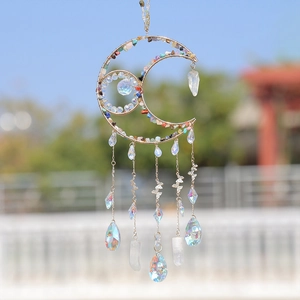 Handmade moon-shaped suncatcher with colorful crystal stones and golden metal butterfly charms