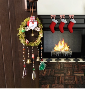 Close-up of Feliz Navidad Christmas wreath with green foliage and agate pendants