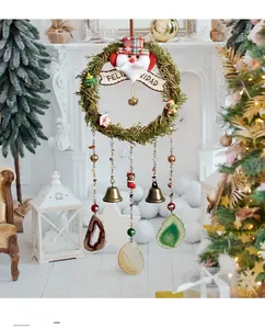 Detail of Christmas wreath featuring Feliz Navidad banner and natural agate slices
