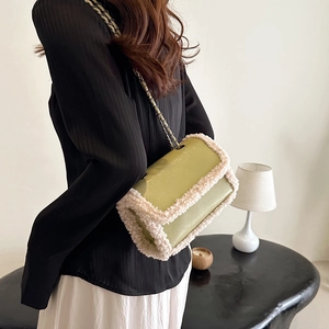 Minimalist matcha green leather crossbody bag with white faux shearling trim and chain