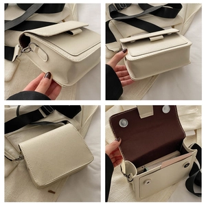 Detalle de bolso bandolera beige minimalista con correa negra y cierre de imán interno
