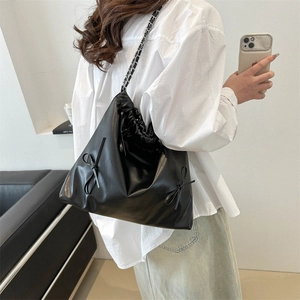 Fashionable black PU leather bucket bag with ribbon bows and metal chain strap