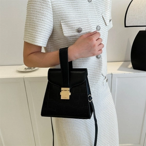 Classic black crocodile texture handbag with gold buckle and adjustable strap