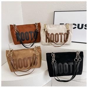 Minimalist faux suede tote bag with bold HOOT letter patch and chain shoulder strap