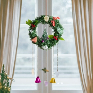Vintage Christmas dreamcatcher wreath with pine needles, crystals, bells, and Merry Christmas ribbon