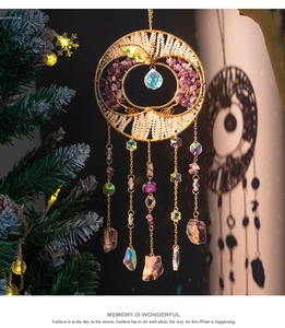 Macro detail of apple-shaped tree of life suncatcher with purple amethyst and crystals