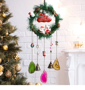 Close-up of Christmas wreath with Santa, agate slices, and Merry Christmas sign