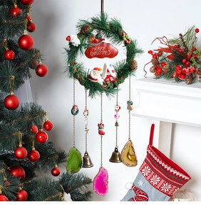 Close-up of a Christmas wreath ornament with Merry Christmas sign and colorful agate slices