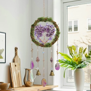 Handmade Tree of Life wind chime with purple crystals and agate slices on a woven ring