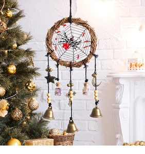 Detail of handcrafted Halloween spider web wreath with beads, small bells and crystal vials
