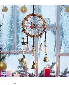 Macro view of a handmade spider dreamcatcher with bells and crystal bottles decoration