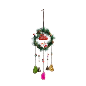 Bohemian Christmas wreath wall hanging with agate slices and merry christmas banner