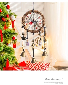 Detailed close-up of handmade Halloween dreamcatcher with spider web and metal bells