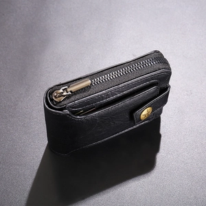 Detail of black leather wallet with star snap button and durable metal zipper