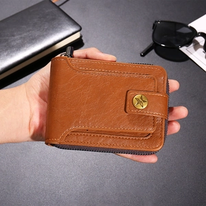 Close-up of a brown leather multi-functional men's wallet with zipper and star snap button