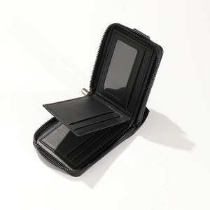 Detail view of black leather wallet with multi-card slots and clear ID window