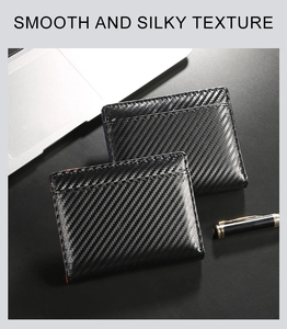 Macro detail of carbon fiber texture and stitching on thin RFID blocking wallet