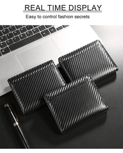 Close-up of carbon fiber texture RFID wallet set on a professional office desk background