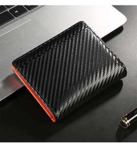 Detail of carbon fiber texture men wallet with bright orange lining and RFID protection