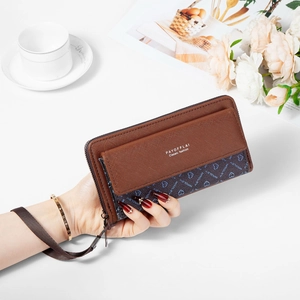 Detail of coffee brown textured leather long wallet with heart print and wrist strap