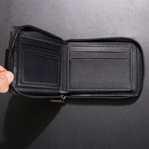 Classic black leather bi-fold men's wallet with zipper closure and multiple card slots