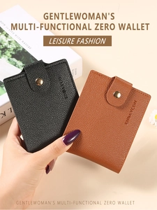 Close-up of black and brown pebbled leather wallets with elegant metal snap buttons