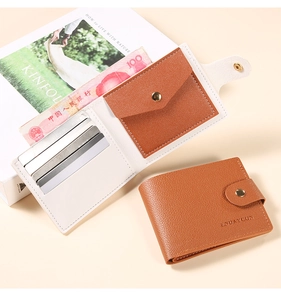 Macro view of brown lychee leather wallet featuring multiple card slots and snap pocket