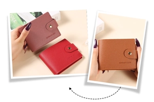 Detail of short wallets in purple, red and brown with textured leather and metal snap