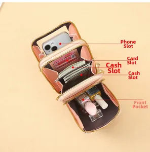 Interior detail of pink leather crossbody bag showing card slots and phone pocket