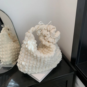 Fashionable off-white pleated shoulder bag with waffle texture and knotted handle