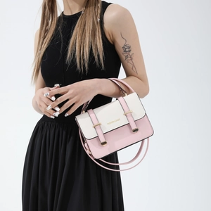 Chic two-tone cream and pink crossbody bag with gold buckles and top handle