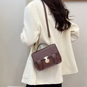Vintage brown leather messenger handbag with golden buckle and adjustable shoulder strap
