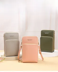 Detailed view of multi-layer zipper crossbody phone bags in three elegant colors