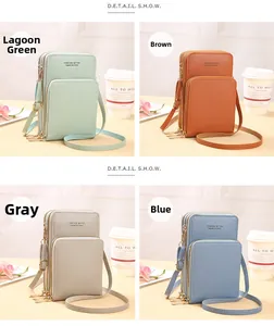 Detail view of multi-compartment phone bags in lake green, brown, gray, and blue colors