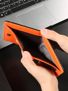 Minimalist carbon fiber RFID blocking wallet for men with contrasting orange interior