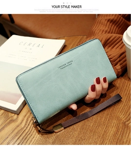 Light blue long zipper wallet with wristlet showing lychee texture and gold hardware