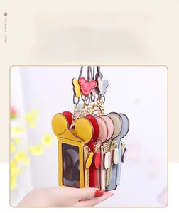 Close-up of colorful cartoon ear mini card holders with litchi grain leather and clear window