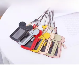 Close-up of colorful cartoon mouse card holders with transparent windows and zippers