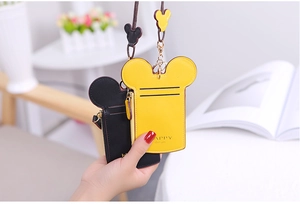 Close-up of cartoon mouse shaped leather card holders with zippers and matching lanyards