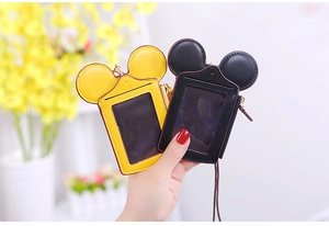 Detailed view of Mickey-shaped card holder with transparent window and metal zipper detail