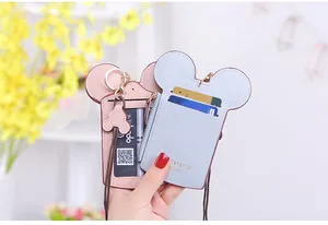 Detail of Mickey ears card holder with zipper pocket and lanyard in pink and blue PU leather