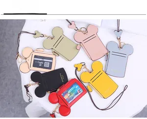 Multiple colorful cartoon mouse head card holders with lanyards on white background