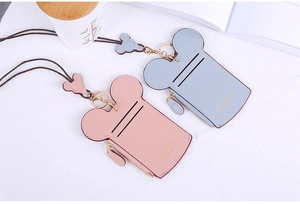 Detail of Mickey-themed PU leather card holders in pink and blue with lanyards