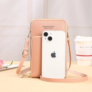 Pink crossbody phone bag with double zippers and adjustable strap shown with a phone