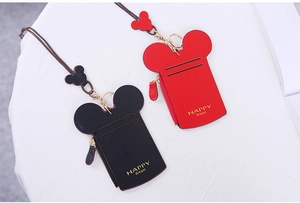 Detail view of cartoon mouse shaped card holder with zipper and lanyard accessories
